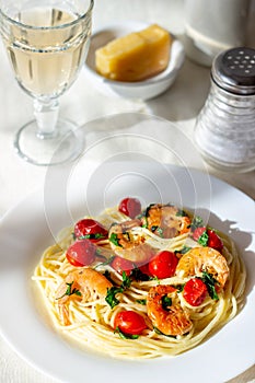 Italian pasta spaghetti with shrimps and tomatoes. National cuisine