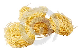 Italian pasta tagliatelle nest isolated on white background.