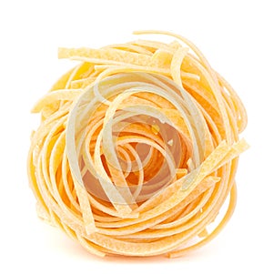 Italian pasta tagliatelle nest isolated on white background photo