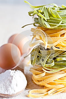 Italian pasta tagliatelli, flour and eggs photo