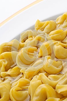 Italian pasta ,tortellini in broth, closeup