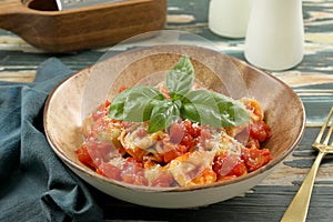 Italian pasta tortellini with tomato sauce and mozzarella cheese