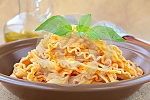 Italian pasta tripoline with tomato sauce