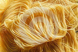 Twisted italian pasta vermicelli close-up. Food background. photo