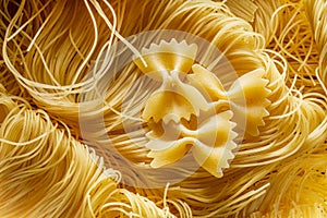 Italian pasta vermicelli and farfalle close-up. Food background