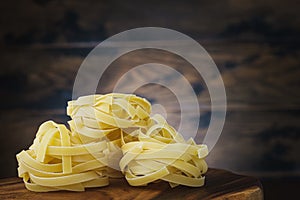 Italian pasta on wooden table