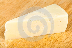 Italian Pecorino Romano cheese on cutting board