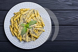 Italian penne pasta with sauce pesto