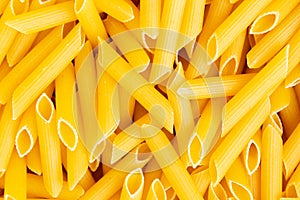 Italian Penne Rigate Macaroni Pasta raw food background