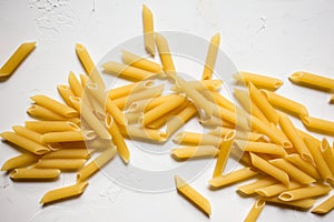 Italian Penne Rigate Macaroni Pasta raw food background