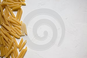 Italian Penne Rigate Macaroni Pasta raw food background