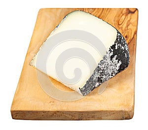 Italian Perla Nera cheese on board isolated photo