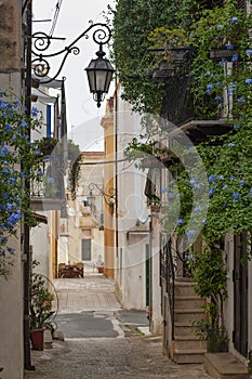 Italian picturesque alleys in San Felice Circeo old town village. Typical old houses reflecting the local architecture