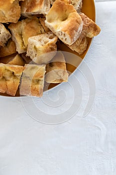 Italian pizza bread chopped for party finger food. Salami, prosciutto and mortadella, italian food birthday party.  Pizza bianca