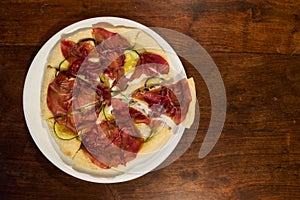 Italian pizza with bresaola, zucchini and eggplant