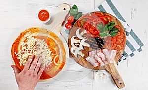 Italian pizza cooking process on white table. Backstage of preparation. Process step by step. Pizza dough and ingredients.