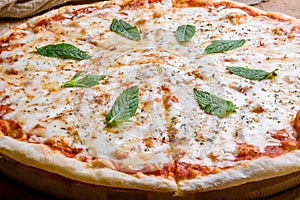 Italian pizza Margherita with cheese and oregano