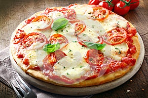 Italian pizza with melted cheese photo