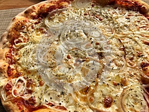 Italian pizza with onions and pepper. photo