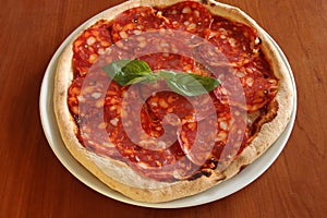 Italian Pizza piccante with chorizo photo