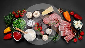 Italian pizza preparation. Variety of traditional cooking ingredients