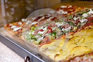 Italian pizza in a restaurant display window in Rome