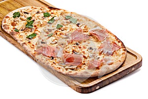 Italian pizza on a wooden chopping board.