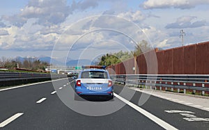 Italian police car patrolling on the highway