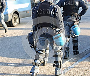 Italian police in riot gear with flak jackets and protective hel