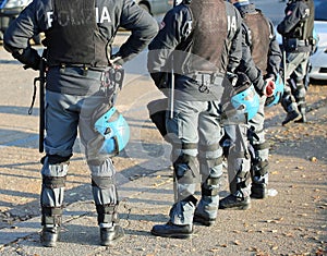 Italian police in riot gear with flak jackets and protective hel