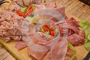 Italian pork salami dish gourmet food on wooden table