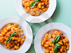 Italian potato gnocchi pasta with tomato sauce and mozzarella cheese