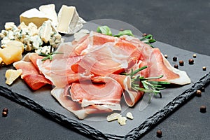 Italian prosciutto crudo or spanish jamon and cheese photo