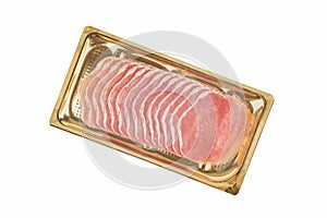 Italian prosciutto or jamon in a gold tray. Isolated on white background. Raw ham.