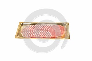Italian prosciutto or jamon in a gold tray. Isolated on white background. Raw ham.