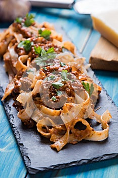 Italian ragu bolognese with flat fettuccine pasta