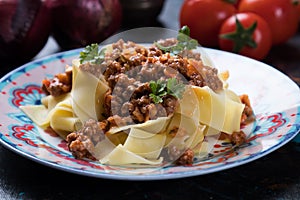 Italian ragu bolognese with flat fettuccine pasta