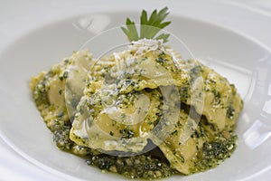 Italian ravioli stuffed with ricotta cheese and pesto photo