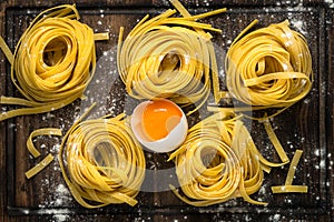 Italian raw homemade pasta tagliatelle.