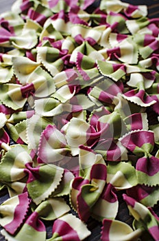 Italian raw multicolored farfalle pasta