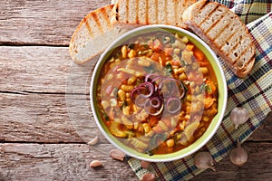 Italian ribollita vegetable soup close up in a bowl. Horizontal