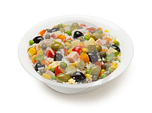 Italian rice salad in a white porcelain salad bowl isolated on a white background.