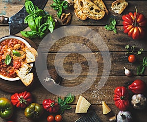 Italian roasted tomato and garlic soup with bread, basil, parmesan