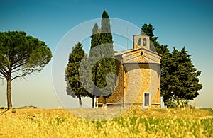 Italian rural landscape with a chapel on a hill