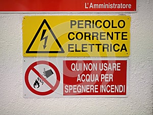 Italian safety signs, Danger electric shock and Do not use water photo