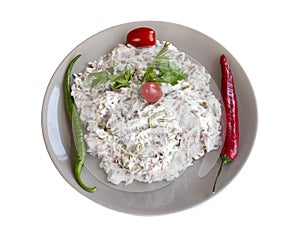 Italian salad with yoghurt on a white background. Turkish cuisine appetizers
