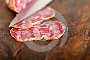 Italian salame pressato pressed slicing photo