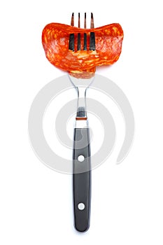 Italian Salami or spanish chorizo on fork