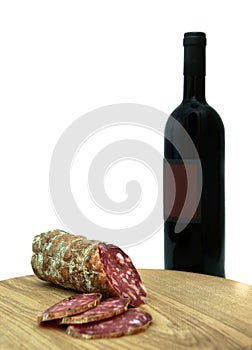 Italian sausage and wine bottle