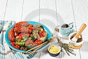 Italian sausages with lentils on a plate, top view